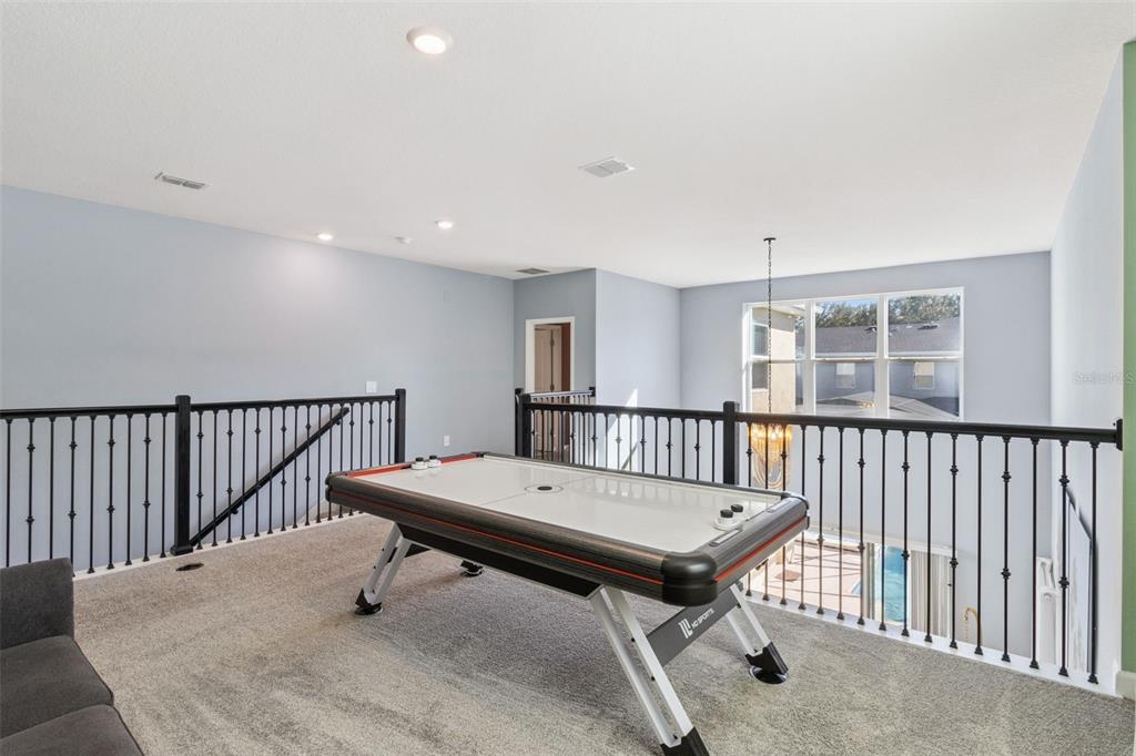 4378 Rhyme Street Kissimmee, FL 34746 - Photo 12 of 41 a view of a hallway with wooden floor and a window