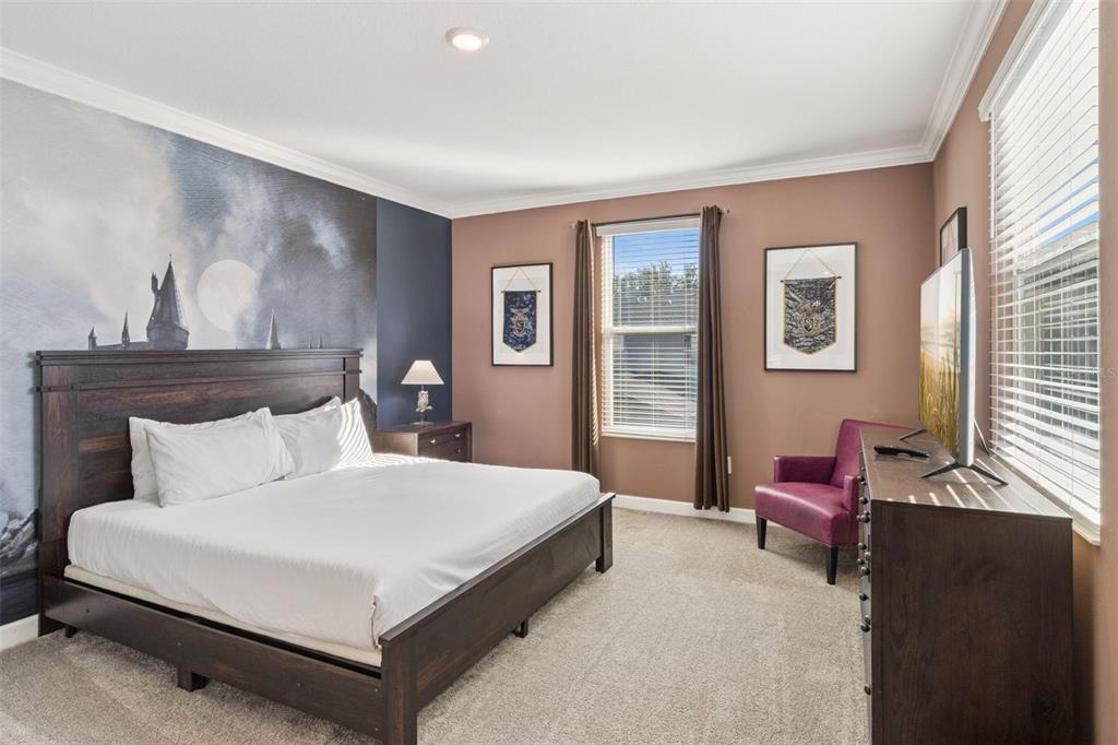 4378 Rhyme Street Kissimmee, FL 34746 - Photo 13 of 41 a bedroom with a bed and wooden floor