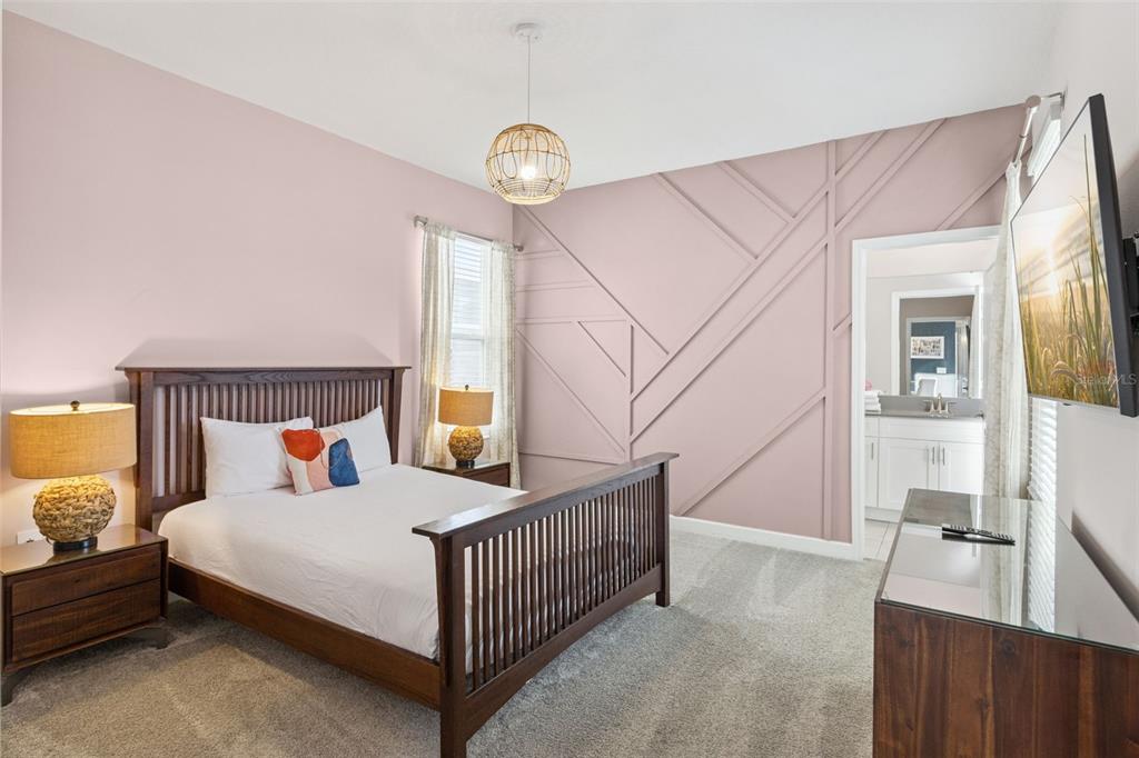 4378 Rhyme Street Kissimmee, FL 34746 - Photo 15 of 41 a bedroom with a bed and a large window