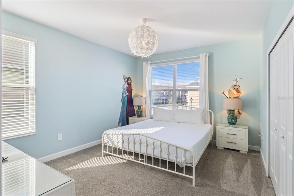 4378 Rhyme Street Kissimmee, FL 34746 - Photo 18 of 41 a bedroom with a bed and a window