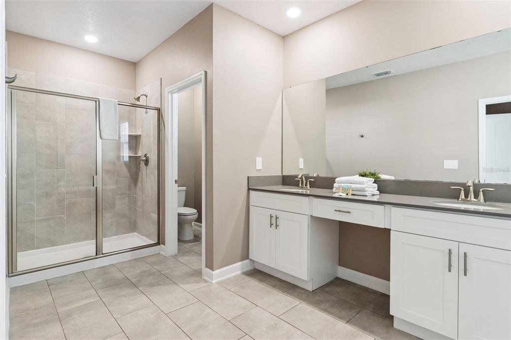 4378 Rhyme Street Kissimmee, FL 34746 - Photo 20 of 41 a bathroom with a shower sink and mirror
