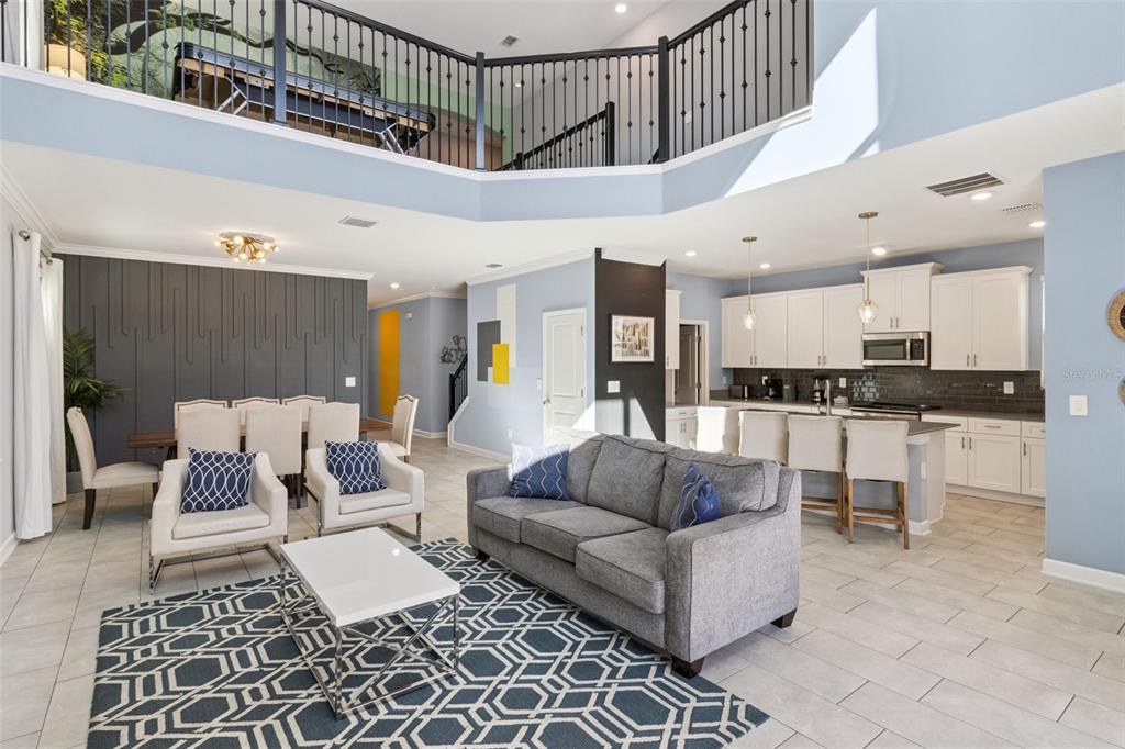 4378 Rhyme Street Kissimmee, FL 34746 - Photo 2 of 41 a living room with furniture and kitchen view