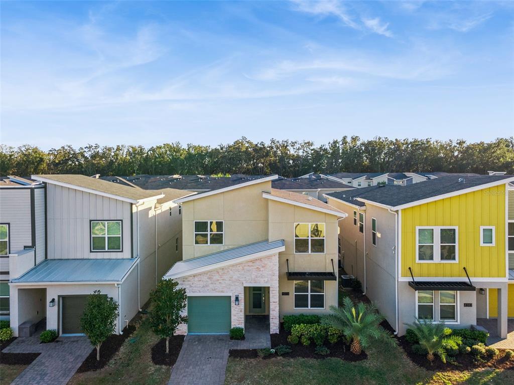 4378 Rhyme Street Kissimmee, FL 34746 - Photo 27 of 41 a view of a building with a garden