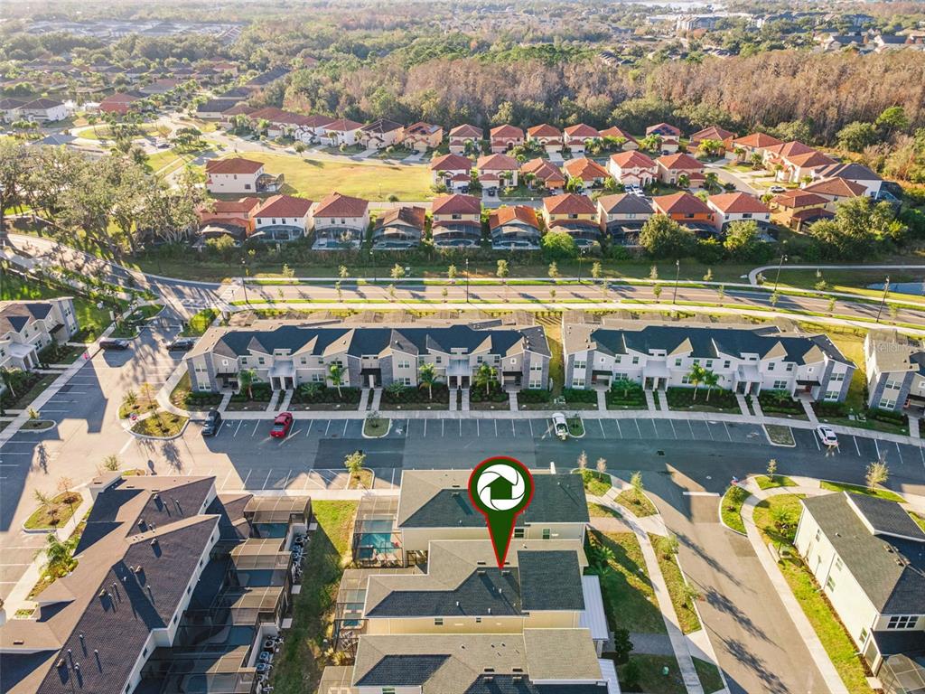 4378 Rhyme Street Kissimmee, FL 34746 - Photo 31 of 41 an aerial view of a swimming pool with lawn chairs and plants