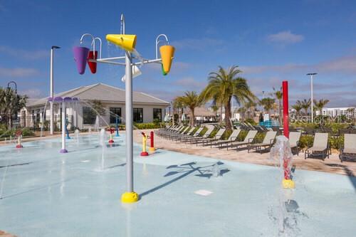 4378 Rhyme Street Kissimmee, FL 34746 - Photo 32 of 41 a view of a swimming pool with a patio