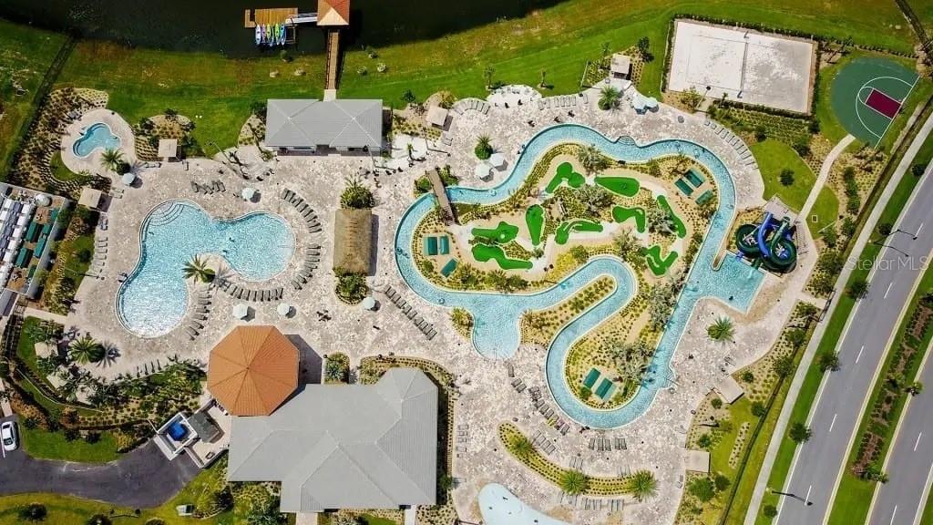 4378 Rhyme Street Kissimmee, FL 34746 - Photo 33 of 41 an aerial view of a swimming pool with outdoor seating and yard