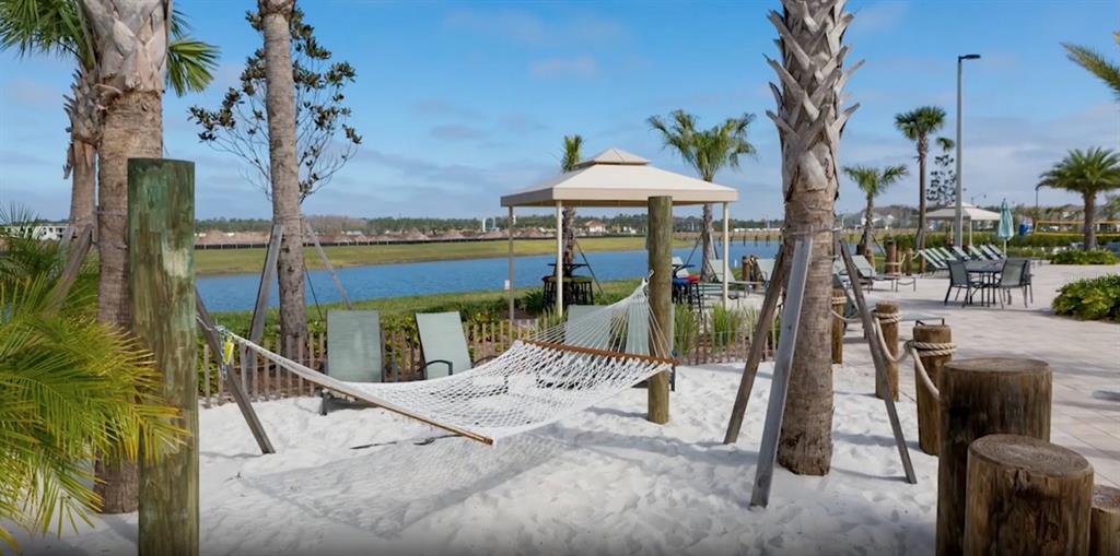4378 Rhyme Street Kissimmee, FL 34746 - Photo 39 of 41 a view of a patio with couches under an umbrella