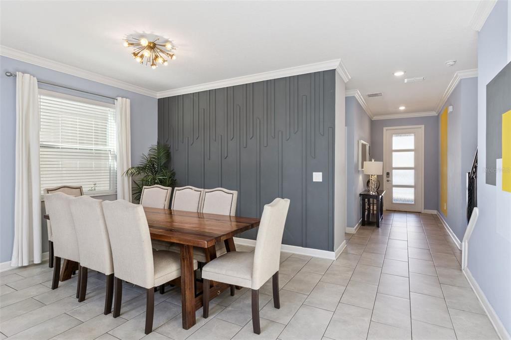 4378 Rhyme Street Kissimmee, FL 34746 - Photo 6 of 41 a view of a dining room with furniture and chandelier