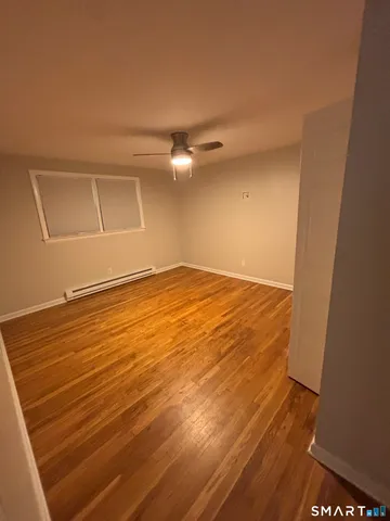 en empty room with wooden floor