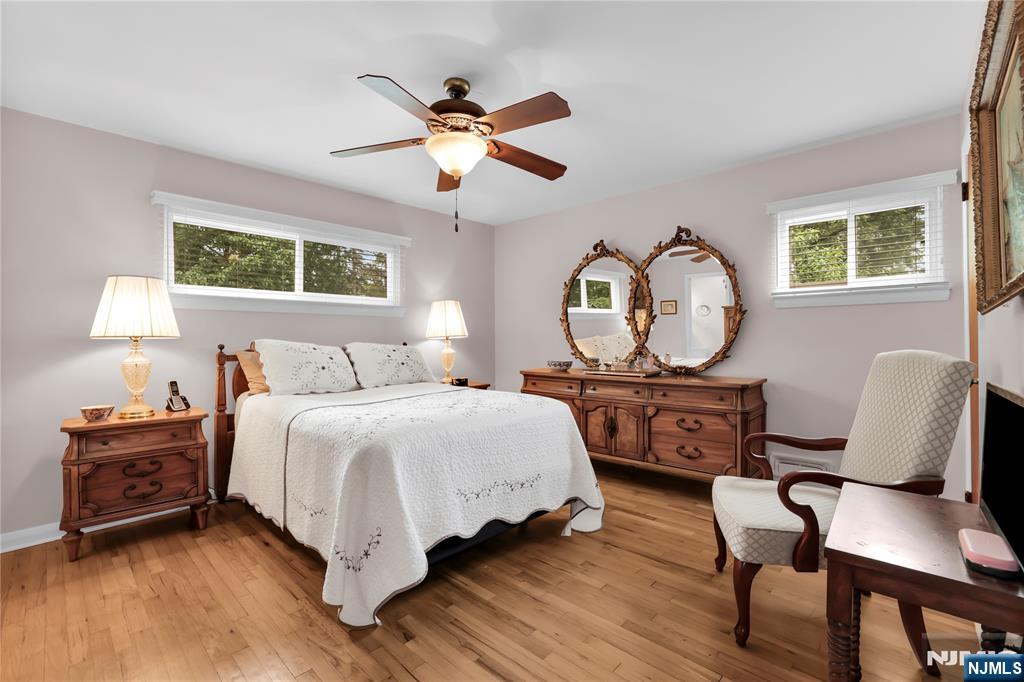23 Ridge Court Cedar Grove, NJ 07009 - Photo 19 of 37 a bedroom with a bed a dresser and chair