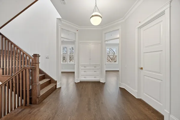 a view of a balcony with wooden floor and fence