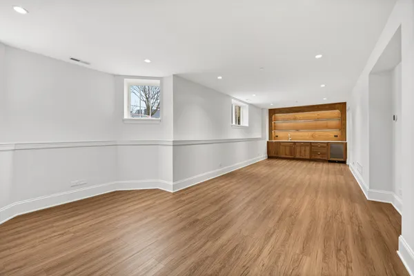 a view of room with closet and wooden floor