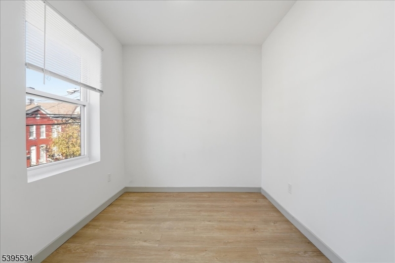 260 South 10th Street, Unit 2 Newark, NJ 07103 - Photo 16 of 26 a view of an empty room and window