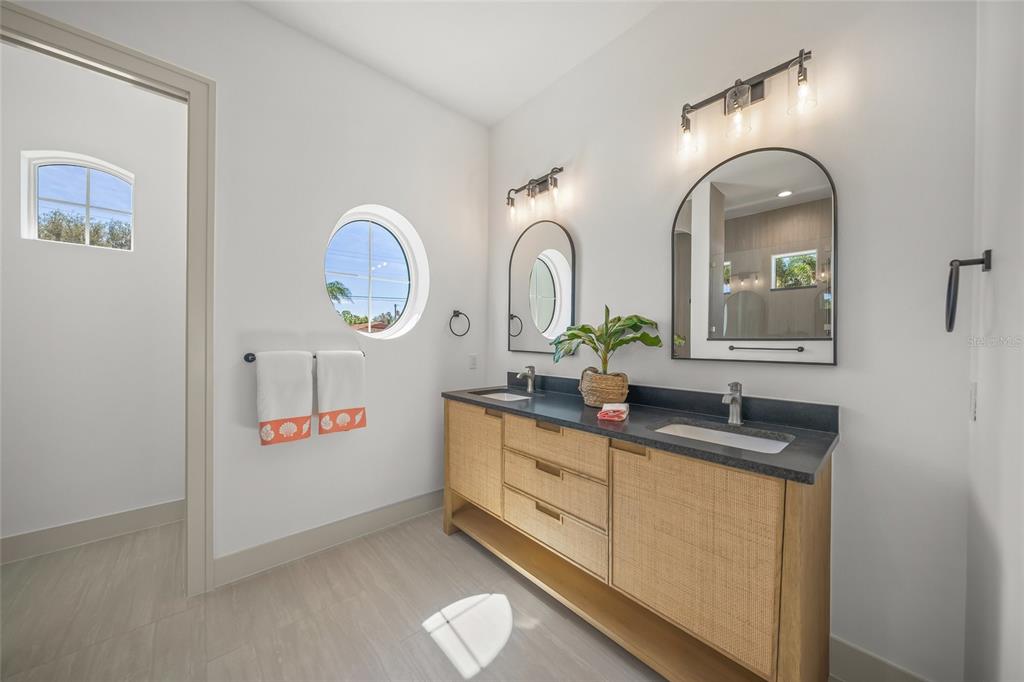 504 Gulf Street Venice, FL 34285 - Photo 20 of 47 a bathroom with double vanity sink and a mirror