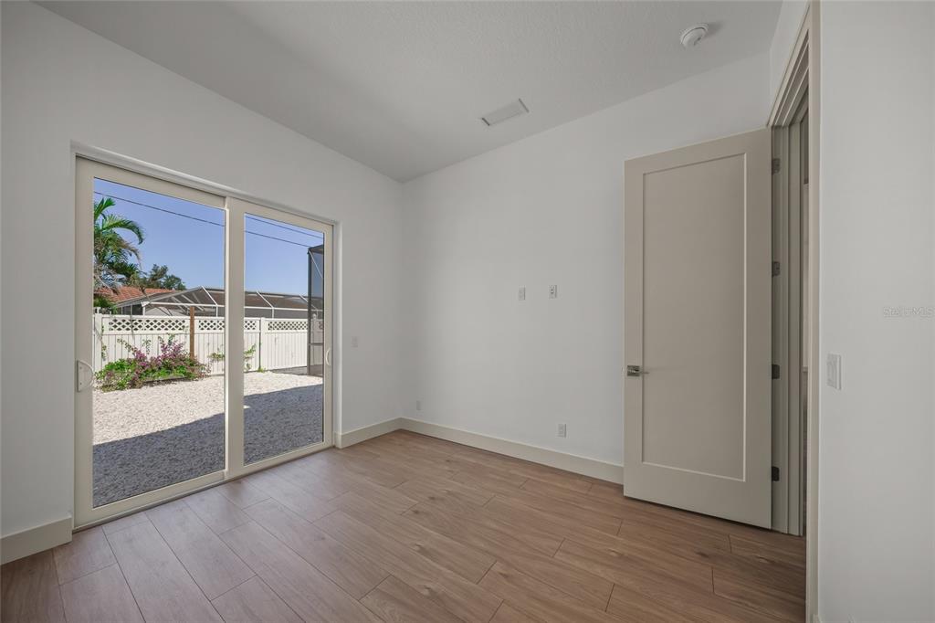504 Gulf Street Venice, FL 34285 - Photo 23 of 47 a view of empty room with wooden floor and fan