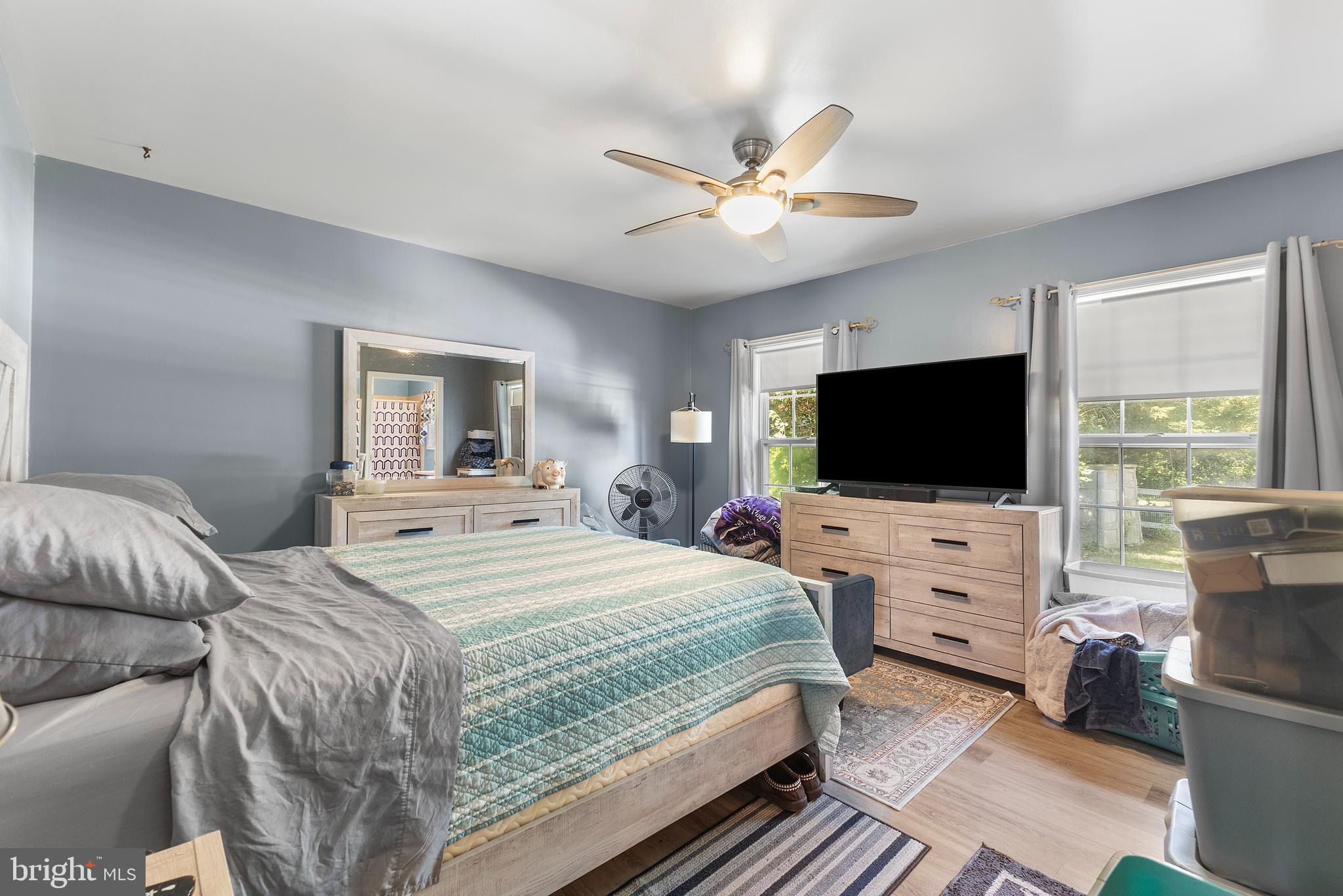7112 East New Market Ellwood Road Hurlock, MD 21643 - Photo 7 of 41 a bedroom with a bed and a flat screen tv
