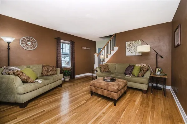 a living room with furniture and a rug