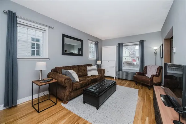 a living room with furniture and a rug