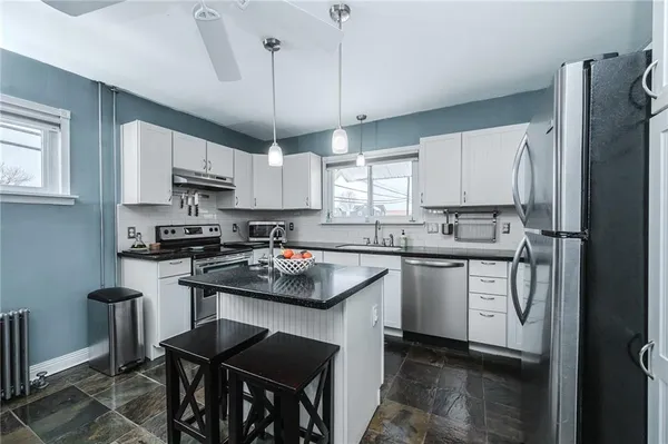 a kitchen with a table and chairs in it