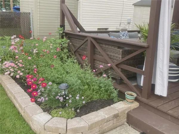 a view of a backyard with flowers