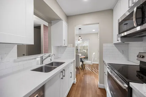 a kitchen with a stove and a microwave