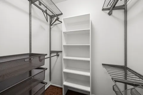 a view of a bedroom with washer and dryer