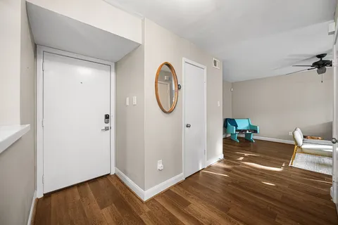 a view of a dining room with furniture and wooden floor
