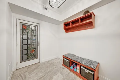 a room with furniture and air conditioner