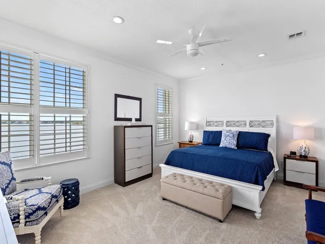 a spacious bedroom with a bed and a closet