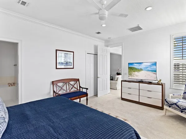 a bedroom with furniture and a dresser