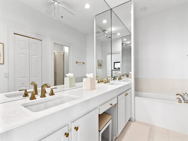 a bathroom with a sink double vanity and a mirror