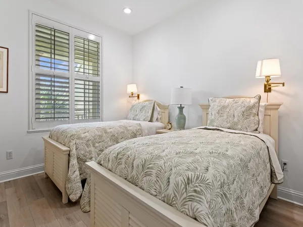 a bedroom with double bed and a window