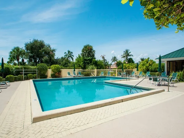 a view of a swimming pool and a yard