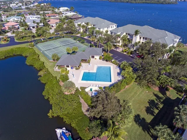 an aerial view of residential houses with outdoor space