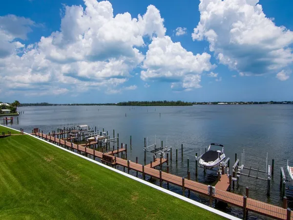 a view of a lake with outdoor seating