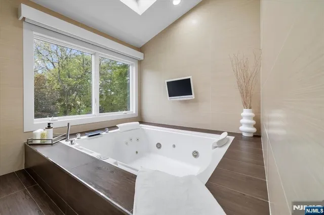 a bathroom with a bathtub and a sink