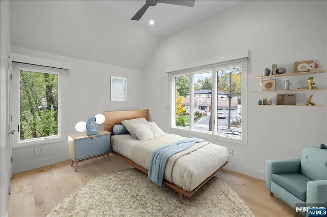 a bedroom with a bed and a couch