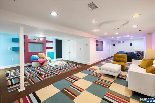 a bedroom with furniture and a rug