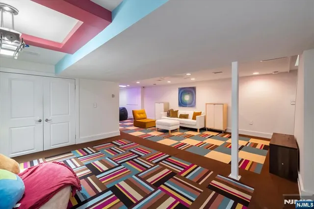 a bed room with a bed furniture and a mirror