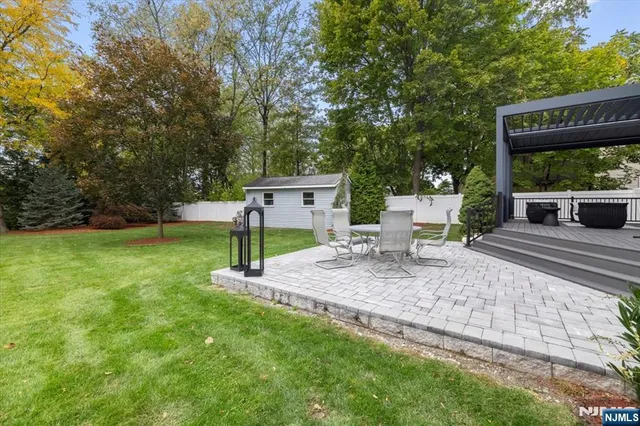 a view of a chair and table in the garden