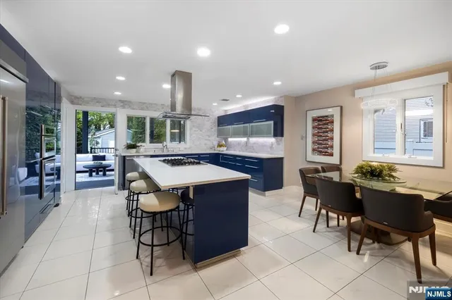 a kitchen with a table and chairs in it
