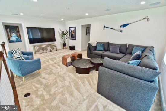 19209 Cavendish Way Lewes, DE 19958 - Photo 4 of 6 a living room with furniture and a flat screen tv
