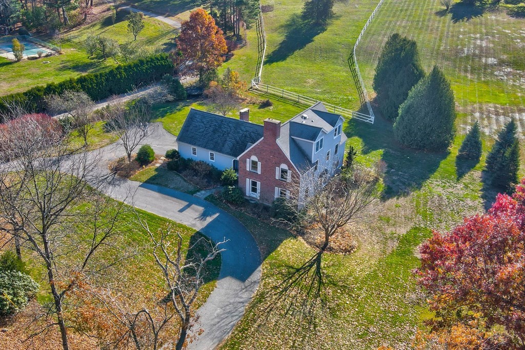 51 Green Road Bolton, MA 01740 - Photo 1 of 25 an aerial view of a house with a yard and swimming pool