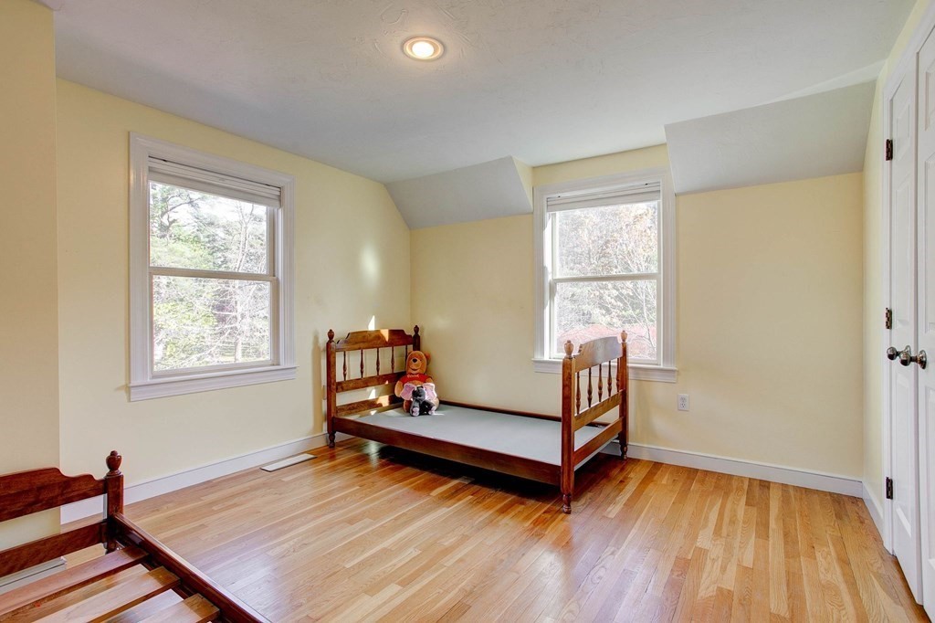 51 Green Road Bolton, MA 01740 - Photo 13 of 25 a sitting room with wooden floor and windows