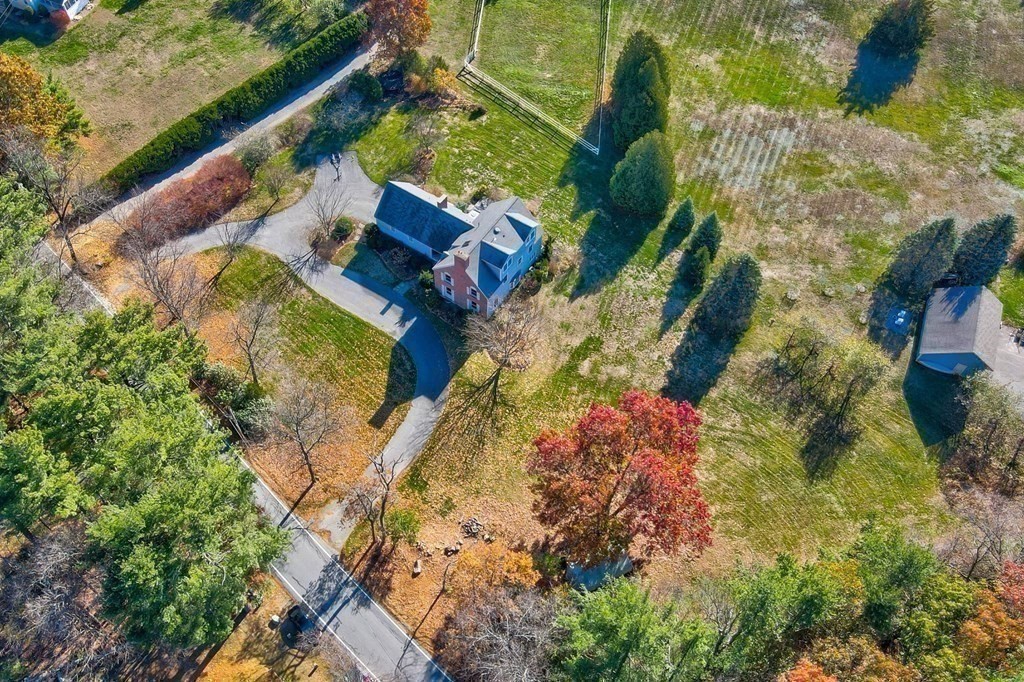 51 Green Road Bolton, MA 01740 - Photo 19 of 25 a view of swimming pool with a yard and plants