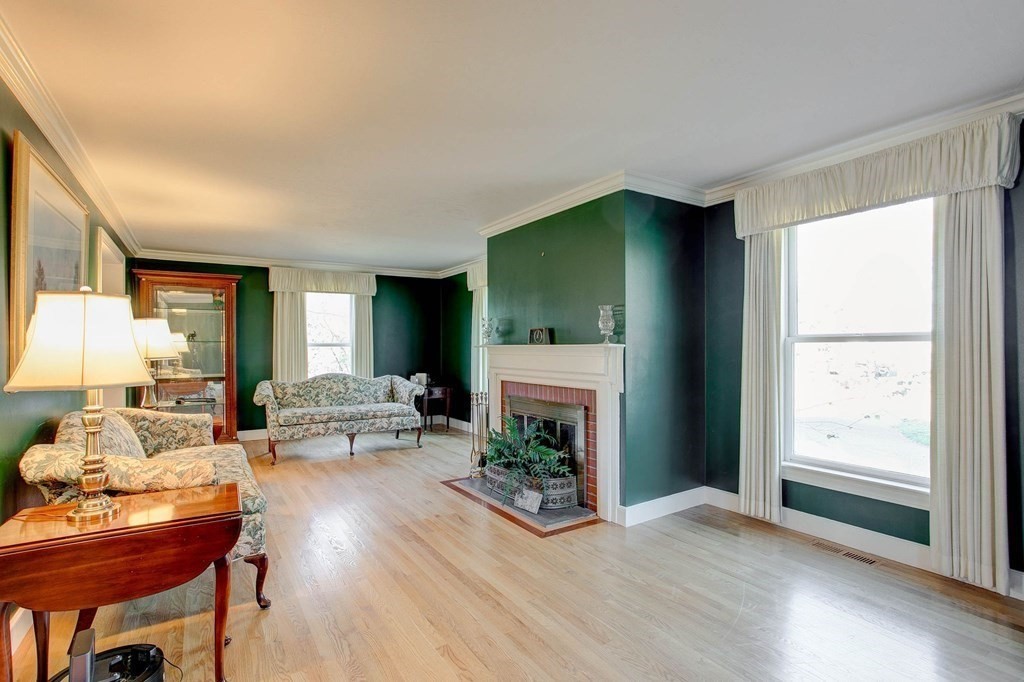 51 Green Road Bolton, MA 01740 - Photo 2 of 25 a living room with furniture and a fireplace