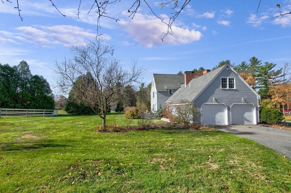 51 Green Road Bolton, MA 01740 - Photo 22 of 25 a house with garden in front of it