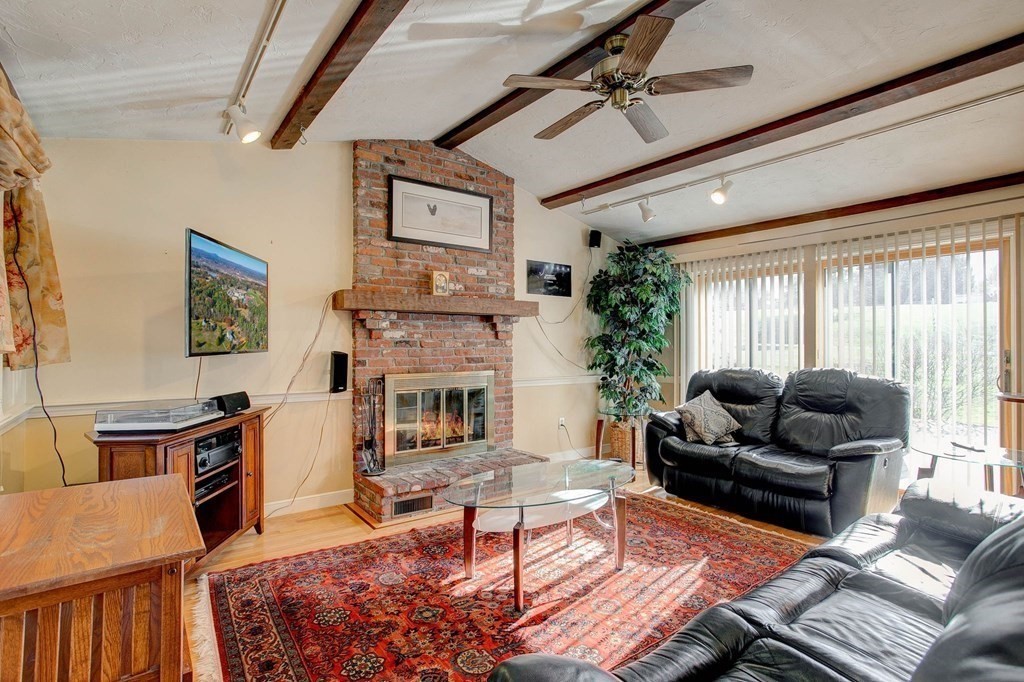 51 Green Road Bolton, MA 01740 - Photo 4 of 25 a living room with furniture and a fireplace