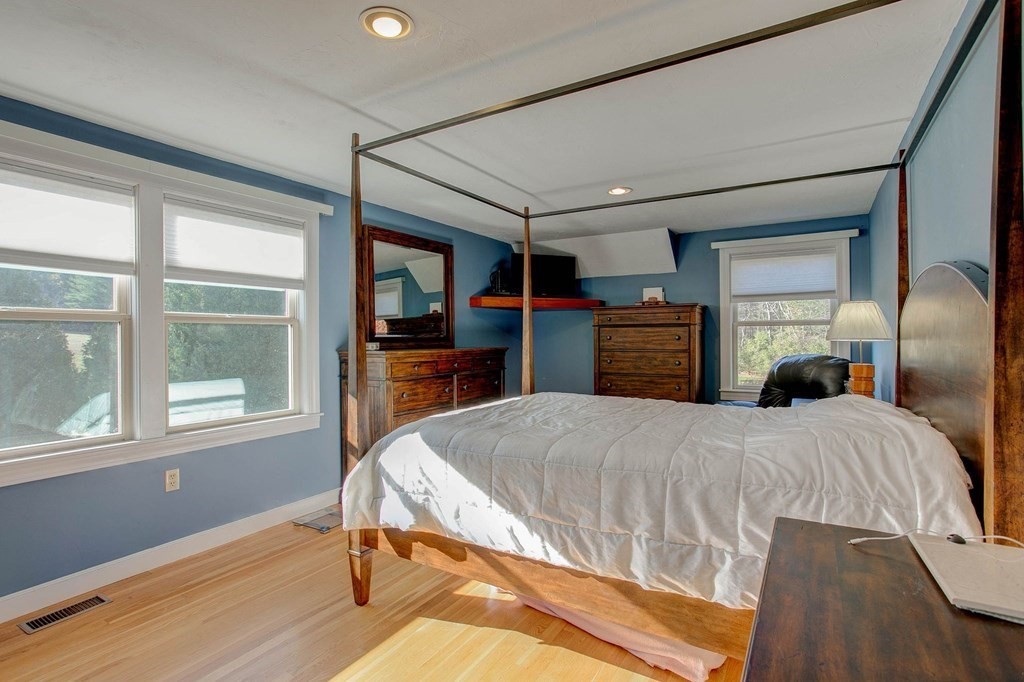 51 Green Road Bolton, MA 01740 - Photo 5 of 25 a bedroom with a bed and wooden floor