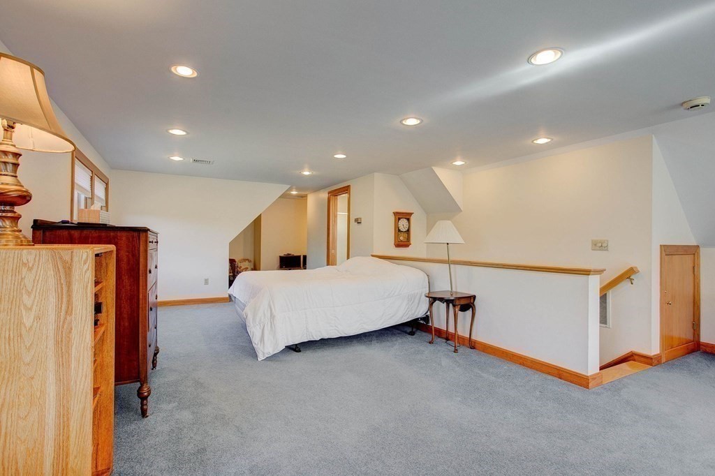 51 Green Road Bolton, MA 01740 - Photo 7 of 25 a living room with furniture and a table